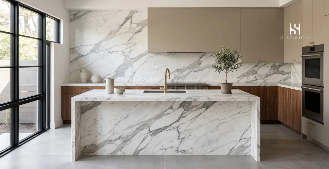 Modern luxury kitchen with Statuario marble island countertop and backsplash